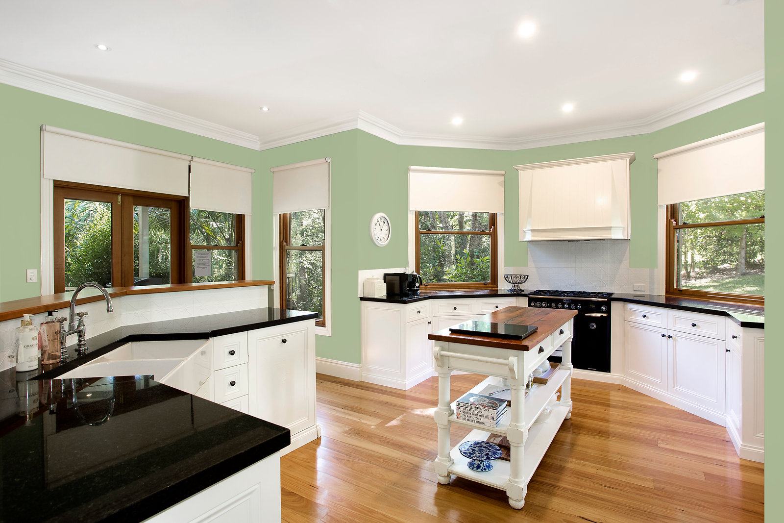 Country kitchen with island bench and garden outlook