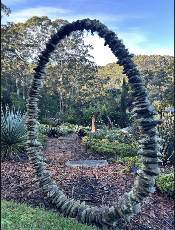 Stone arch sculpture in the native garden